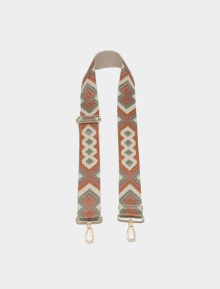 A fabric camera strap featuring a Southwestern geometric pattern in terracotta, sage green, and cream, with gold-tone metal clips and a beige leather end cap, shown against a light gray background.