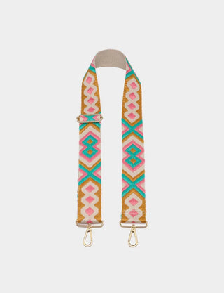A wide, adjustable fabric shoulder strap featuring a colorful geometric pattern in pink, teal, yellow, and white, with gold-tone metal hardware on a light gray background.