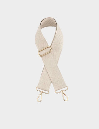 Beige quilted bag strap with gold hardware on a white background