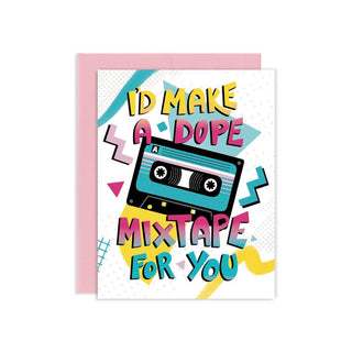 A greeting card with a retro 80s/90s cassette tape design and the text 'I'D MAKE A DOPE MIXTAPE FOR YOU', shown with a pink envelope behind it on a white background.