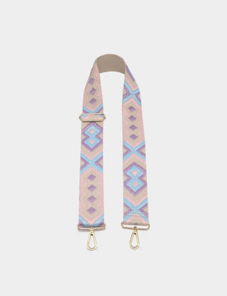 A fabric camera strap featuring a light pink and lavender geometric pattern with gold-tone metal hardware, displayed against a light gray background.