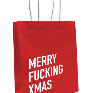 A red paper shopping bag with white text reading 'MERRY FUCKING XMAS' and white paper handles, shown on a plain white background.