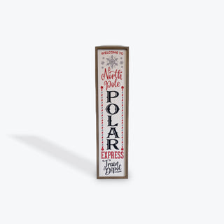 A vertical rectangular decorative sign with a thin brown frame, featuring the words “Welcome to North Pole POLAR EXPRESS Fruit & Gospel” in red and black lettering on a white background, shown on a light gray studio background.