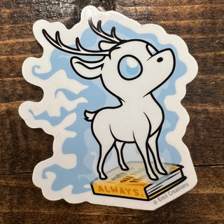 Sticker of a cartoon deer with antlers on a wooden surface