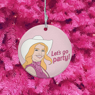 Decorative ornament with a cartoon character and 'Let's go party!' text on a pink tree background