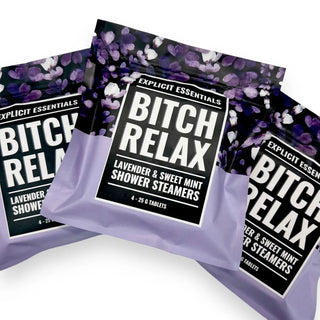 Packaging of 'Bitch Relax' shower steamers with a purple floral design on a white background.