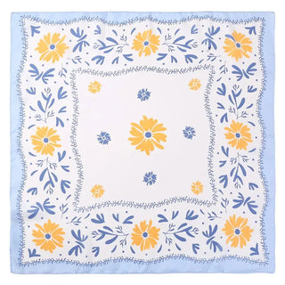 Floral patterned fabric with yellow and blue flowers on a white background