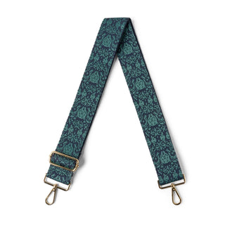 Green floral patterned strap with gold hardware on a white background