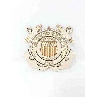 A wooden United States Coast Guard emblem ornament, crafted from light natural wood with engraved details, shown on a plain white background.