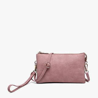 Pink crossbody bag on a white background