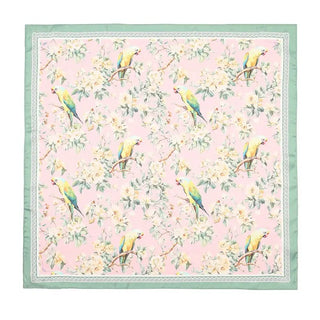 Floral scarf with a colorful parrot pattern on a pink background