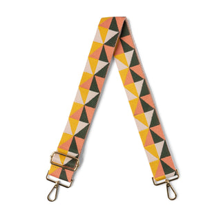Multicolored geometric patterned strap with gold hardware on a white background