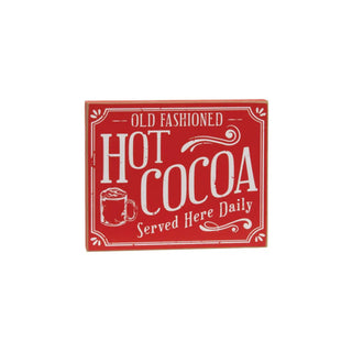 A square red decorative sign with white distressed lettering that reads 'OLD FASHIONED HOT COCOA Served Here Daily' and a small mug illustration, shown on a plain white background.