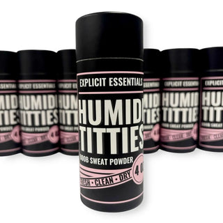 Black and pink 'Humid Titties' product with 'Explicit Essentials' branding on a white background.