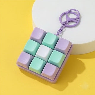Keychain with pastel-colored keys on a yellow background