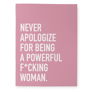 A pink rectangular  notebook featuring the text 'NEVER APOLOGIZE FOR BEING A POWERFUL F*CKING WOMAN.' in large white sans-serif letters, shown against a plain white background.