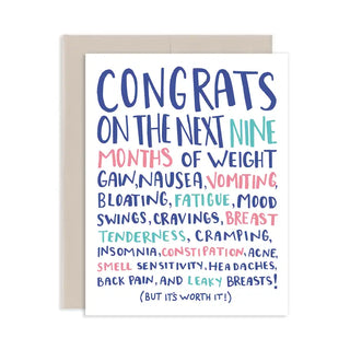 A white congratulations card with colorful hand-lettered text listing the nine months of breastfeeding challenges, shown with a beige envelope on a white background.