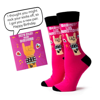 Pink socks with birthday design and matching card on a white background