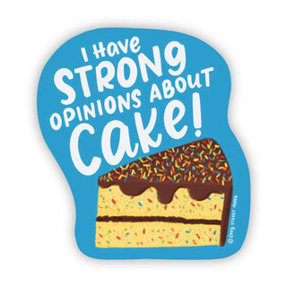 A die-cut sticker with a bright blue background featuring the text 'I have STRONG OPINIONS ABOUT Cake!' in white lettering and an illustration of a slice of layered cake with chocolate frosting and rainbow sprinkles. A small vertical brand mark reading 'GTS Sweet Maker' appears near the lower right edge of the cake illustration.