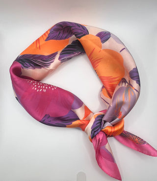Colorful floral-patterned scarf on a white background