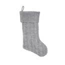 Gray knitted Christmas stocking on a white background